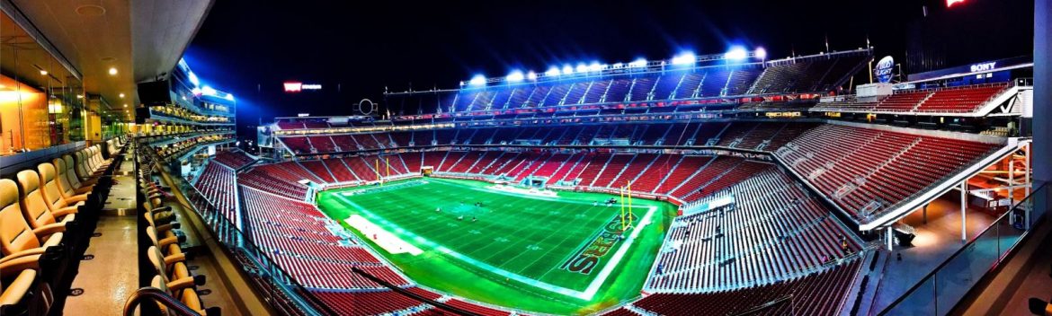 Smunday petition, view of empty lit up football stadium.