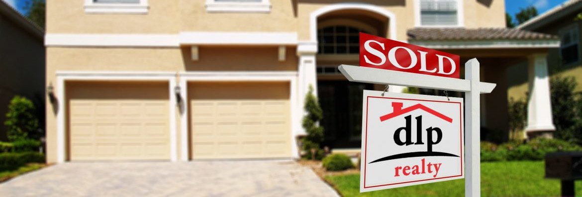 Dream Live Prosper Companies. A sold sign in front of a house with dlp realty on the sign.
