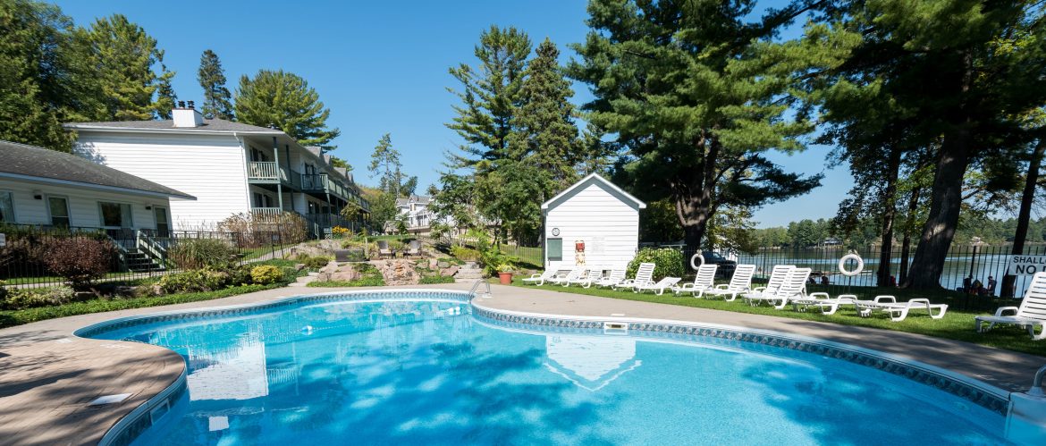 Bayview Wildwood Resort outdoor pool with trees around.