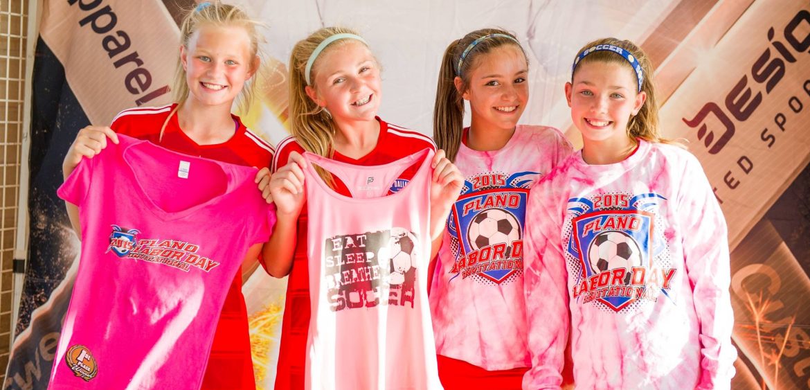 Fine Designs. 4 girls showing off shirts.