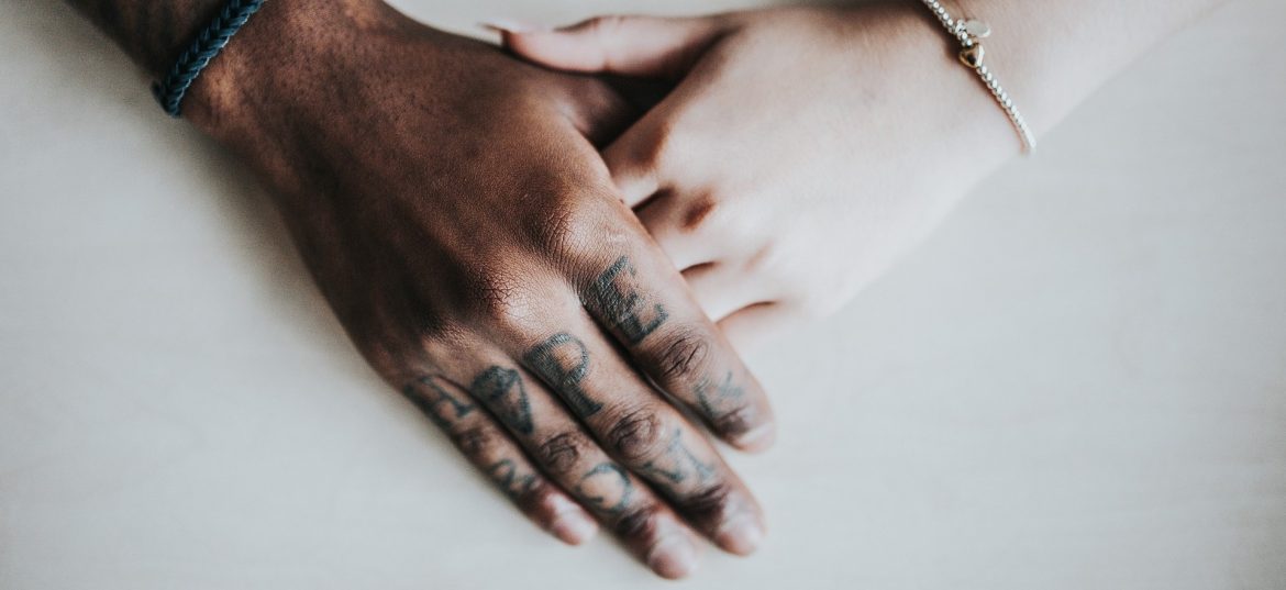 American Addiction Treatment Association. One hand on top of another.