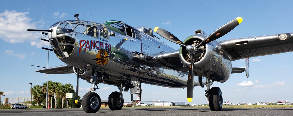 The Bartow Municipal Airport, old style prop plane with weapons.