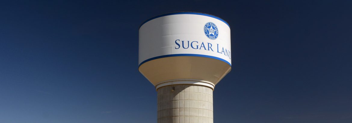 Phoenix Fabricators & Erectors. A water tower with the word Sugar and another word after it.