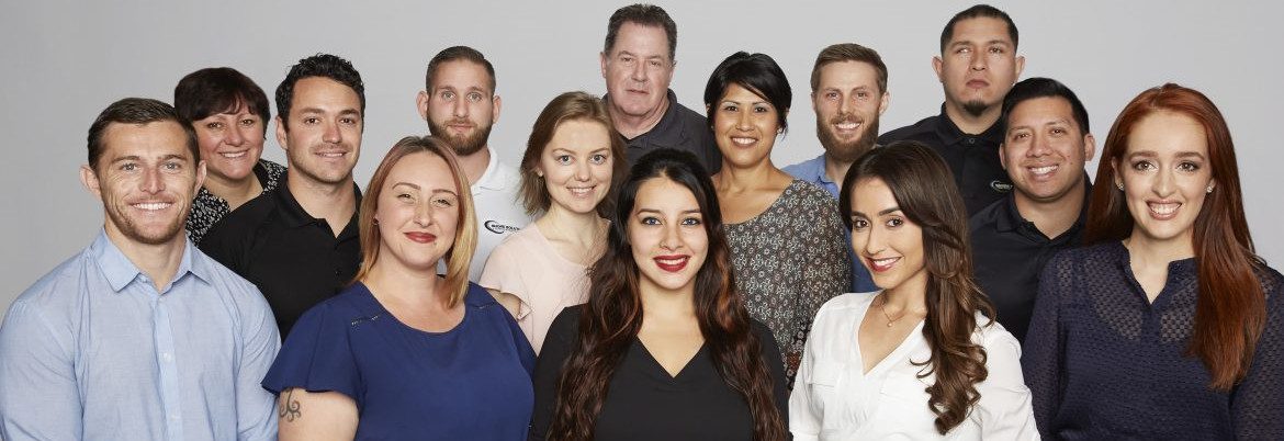 Shore Solutions, employees stand in a group for a photo.