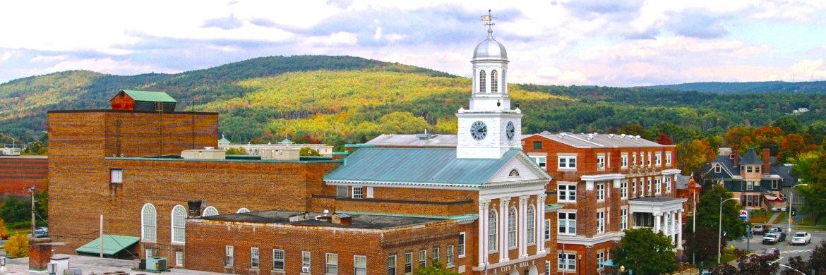 Aerial view of City Hall for Lebanon New Hampshire. Red brick buildings.