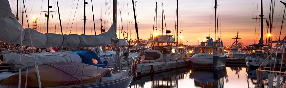 City of Rimouski Marina view. Sailboats at dock on the water.