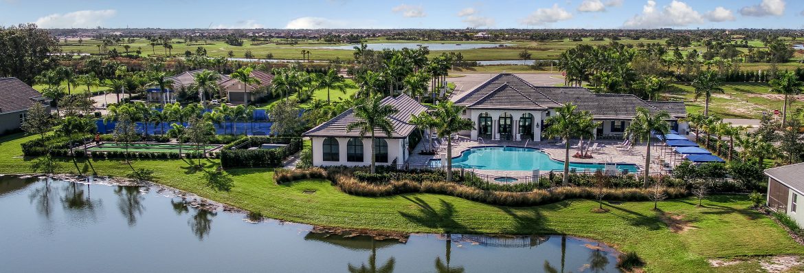 Florida Green Building Coalition. An aerial view of a community pool, tennis courts and more.
