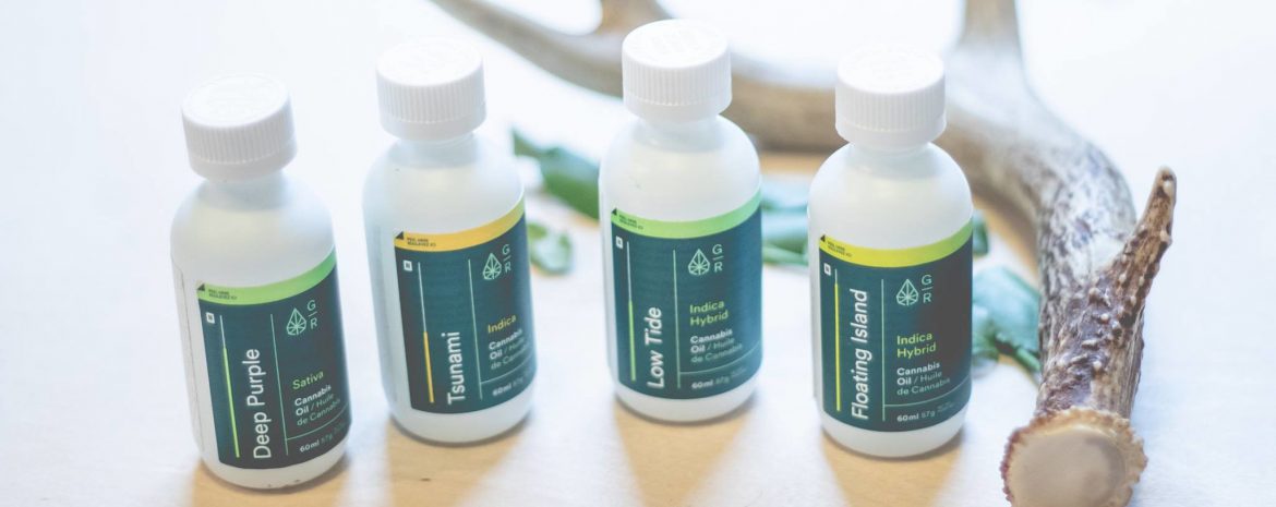 Green Relief; 4 bottles of cannabis oils in a row with an animal horn behind them.