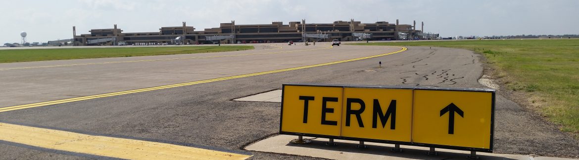 Lubbock Preston Smith International Airport TERM sign pointing towards their terminals.