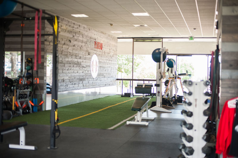Core Progression. View of the inside of a new gym showing exercise equipment.