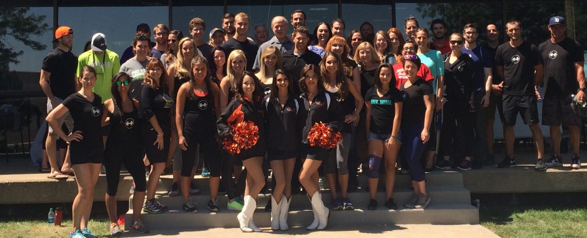 Core Progression, grand opening photo with a group of people outside the front of the store.