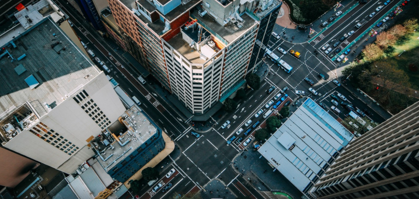 Somat Engineering Inc.; Aerial city view with cars and tall buildings.