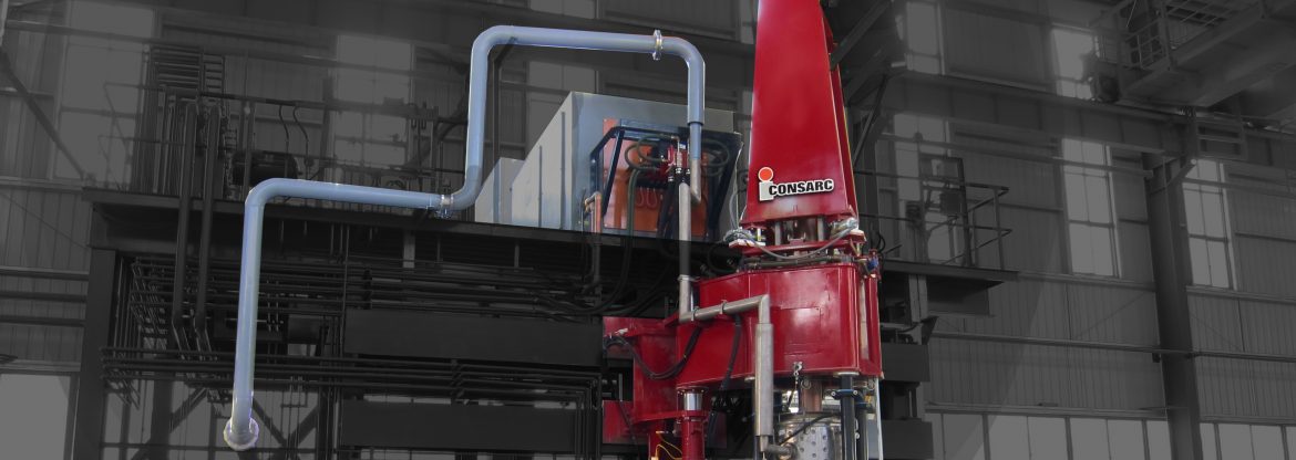 Consarc Corporation, example of their product set up showing a tall red piece of machinery with pipes coming off of it.