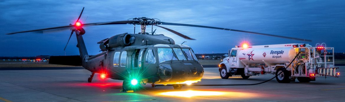 Draughon-Miller Central Texas Regional Airport, a helicopter sits getting fueled on the runway by a fuel truck.