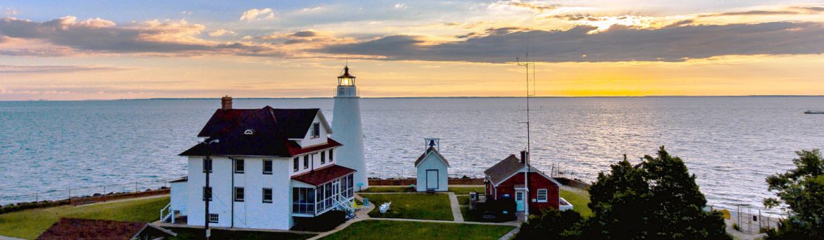 Calvert County, Maryland Cove Point Lighthouse at sunset, aerial.