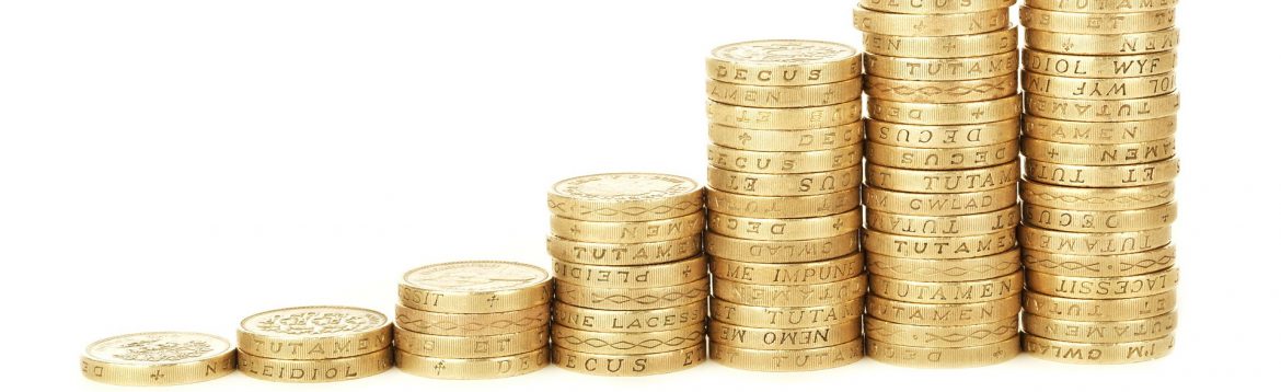 Coins stacked in a row starting with one coin and getting taller.