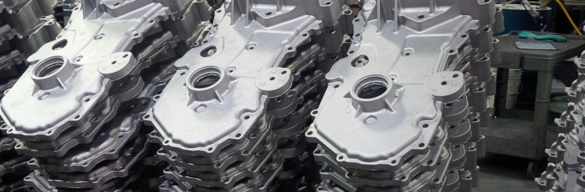 Great Lakes Die Cast Corp; A stack of metal components.