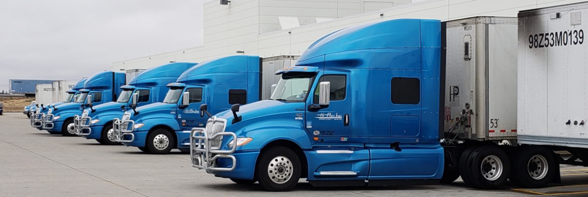 MTC Transportation semi trucks in a row.