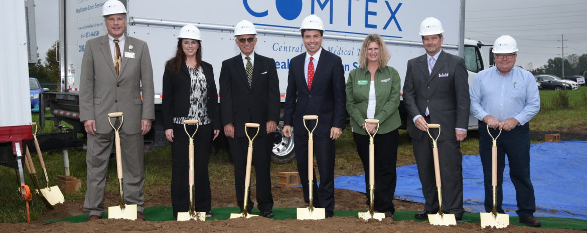 Grow Ashland / Ashland County, Ohio. A group of people with hard hats an shovels at a breaking ground ceremony.