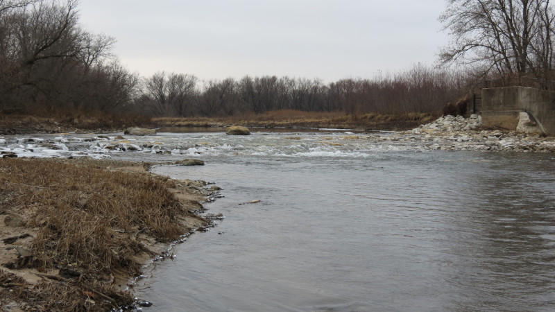 Linn County, Iowa Roller Dam Conversion showing water flowing over rocks.