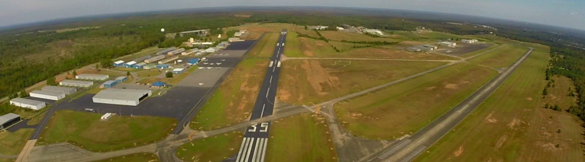North Little Rock Municipal Airport aerial view of runway and buildings.