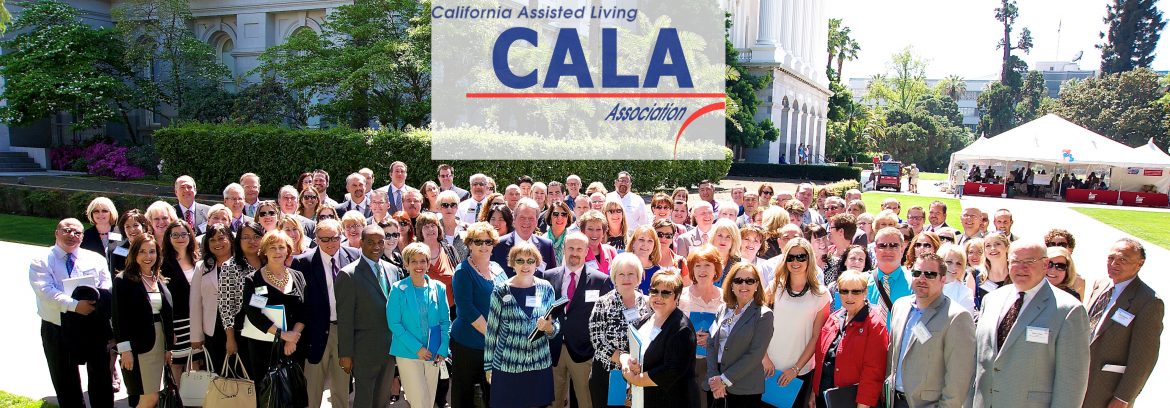 California Assisted Living Association group of members posing for a photo and a logo for CALA located above them in the photo.