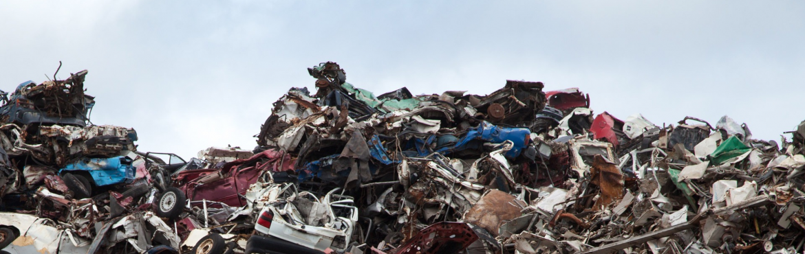 Edward Arnold Scrap Processors, Inc.; A pile of scrap metal with parts of vehicles visible.