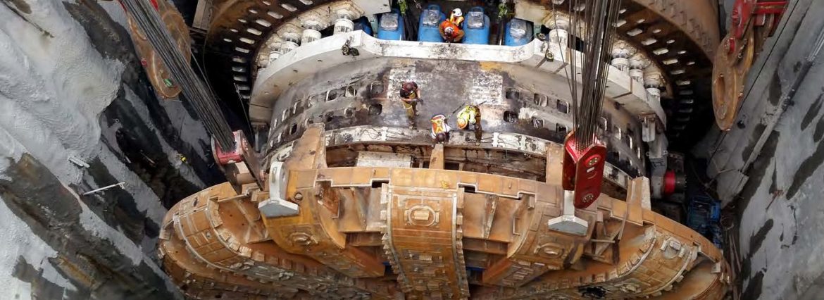 National Welding Corporation. View from above of a large boring machine with workers visible on top.