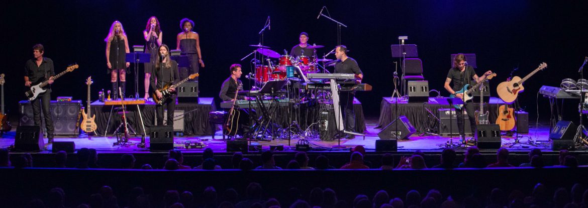 The RP Funding Center. A band with backup singers on stage.