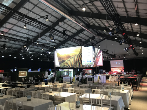 Aviva Centre auction even set up showing dining tables and numerous TV displays in the middle.