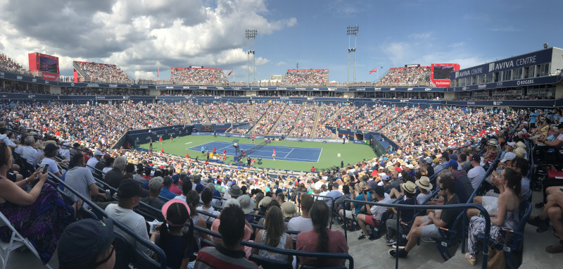 Aviva Centre tennis match during the day with a full stadium.
