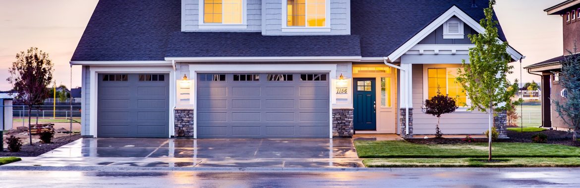 Front view of a new home with a wet driveway and street and lights inside turned on. Brightway Insurance Encourages Homeowners, Renters to Get Ready for Hurricane Season