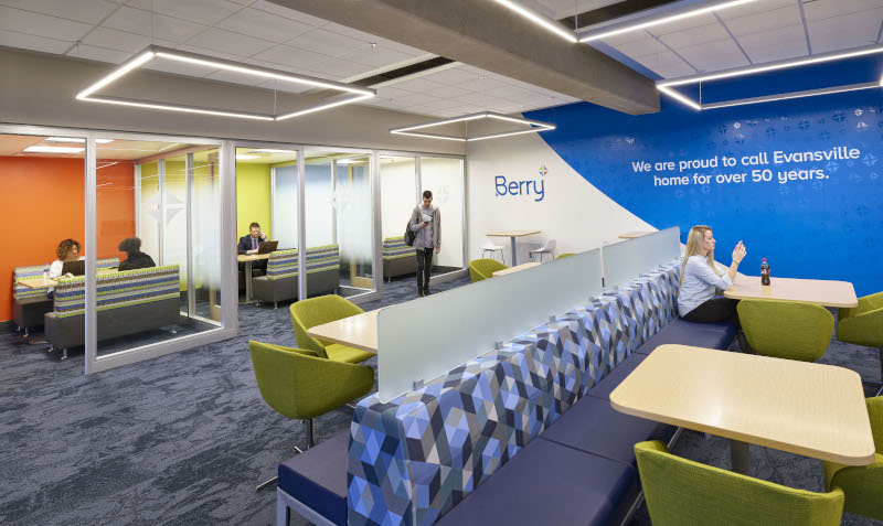 Evansville Regional Airport interior view of Berry Lounge with couches, tables and separate more private rooms.