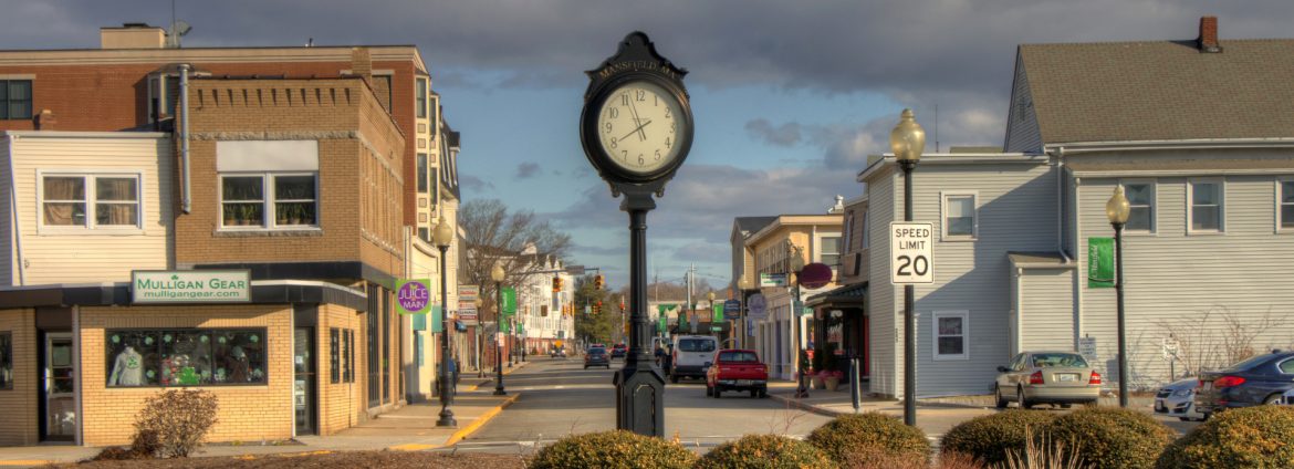 Mansfield, Massachusetts view of N Main downtown with a clock front and center.
