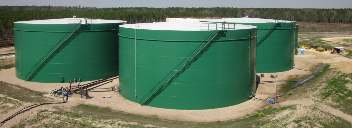 Pittsburg Tank & Tower Group example of work showing 3 large metal tanks with piping leading away.