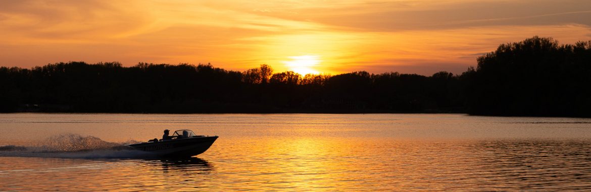 Albert Lea, Minnesota edgewater park boating at sunset. Photo by Teresa Kauffmann.