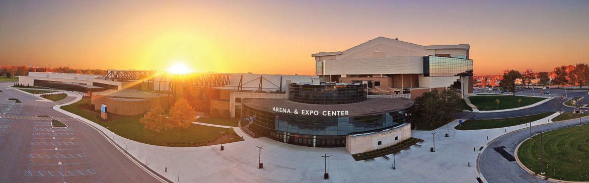 Allen County War Memorial Coliseum building photo with sun shining over the horizon.