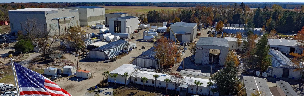 Augusta Fiberglass aerial view of their property showing multiple buildings and an american flag.
