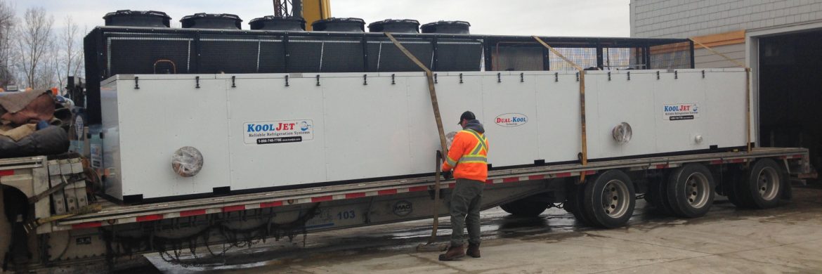 KoolJet unit being strapped in onto a truck bed.