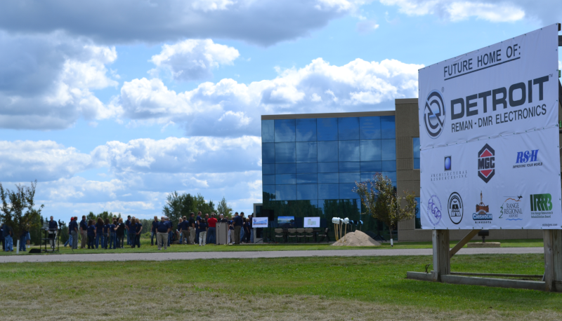 Range Regional Airport, sign saying the future home of Detroit Reman - DMR Electronics and organization logos below that.