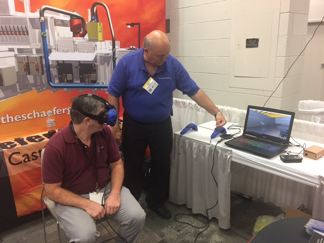 The Schaefer Group's Kent Guthrie demoing VR system at a show.