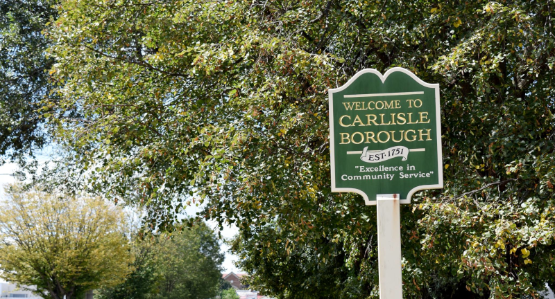 Borough of Carlisle, Pennsylvania, PA, city sign with greenery behind.
