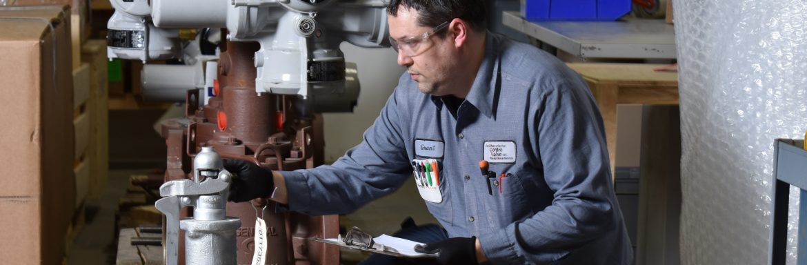 Contro Valve Inc employee looking at a valve.