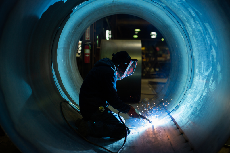 Newberry Tanks & Equipment LLC employee working inside of a tank.