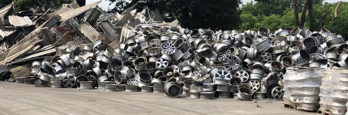 The Non Ferrous Founders’ Society aluminum scrap piles on the ground.