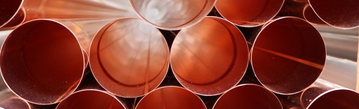 The Copper Development Association, stock photo showing the end view of a stack of copper pipes.