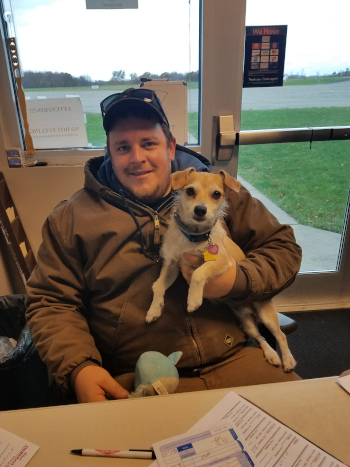 Joseph A. Hardy Connellsville Airport Head Lineman, Brandon Dowden with Airport Mascot Jack.