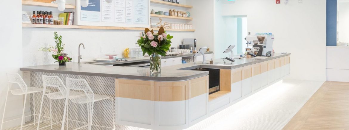 The Fifteen Group, example of work showing a brightly lit counter with a menu behind it..