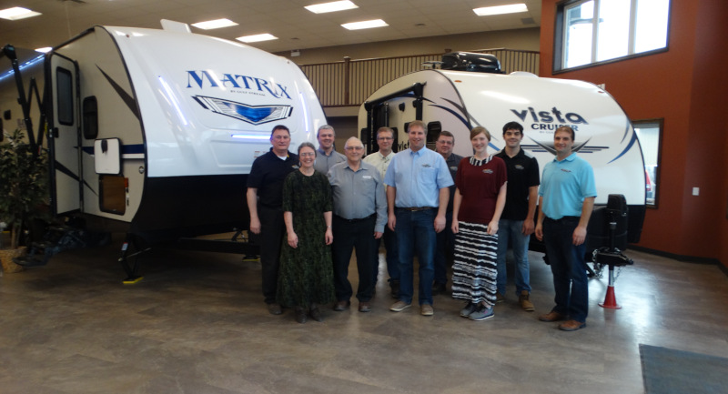 Weberlane Manufacturing Inc. office staff photos inside retail showroom.