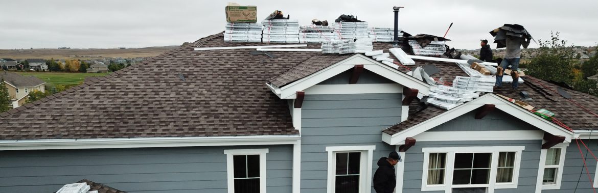 Elite Roofing employees working on a rooftop.